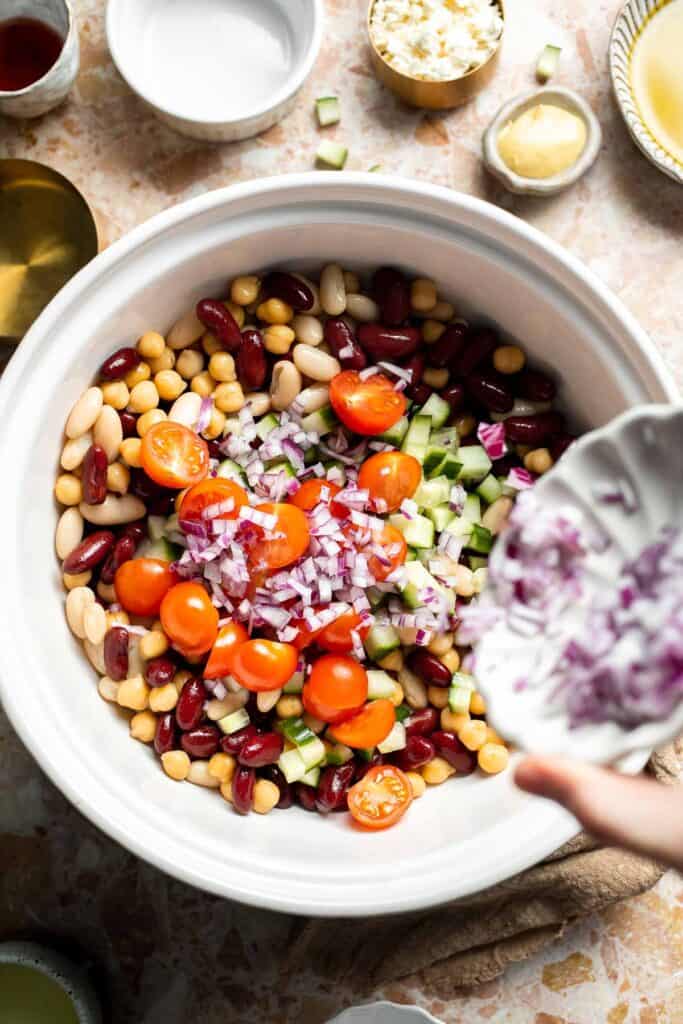Mediterranean dense bean salad packed with chickpeas, vegetables, feta, and lemon dressing. Healthy meal prep salad full of fresh flavor. | aheadofthyme.com