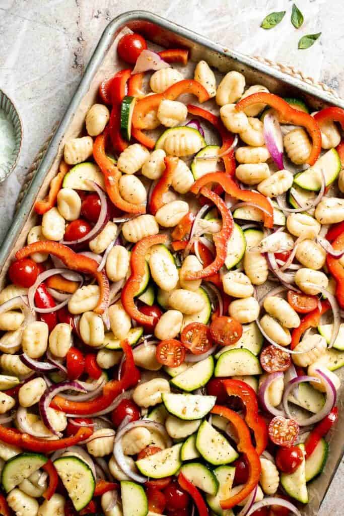 Easy sheet pan gnocchi and vegetables roasted until golden and crispy. A simple one-pan vegetarian dinner ready in 30 minutes. | aheadofthyme.com