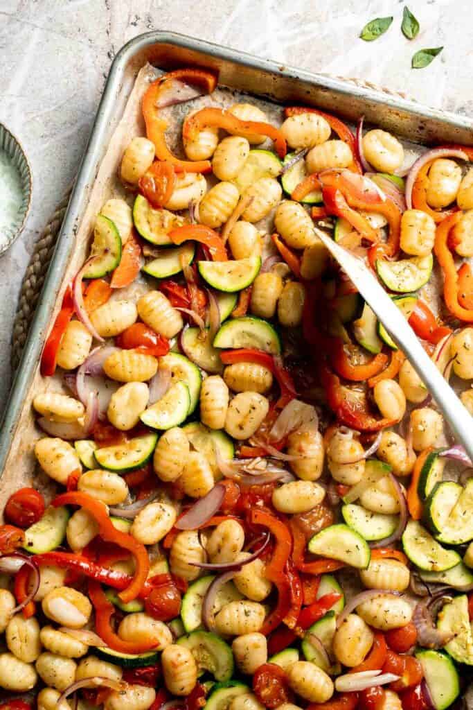 Easy sheet pan gnocchi and vegetables roasted until golden and crispy. A simple one-pan vegetarian dinner ready in 30 minutes. | aheadofthyme.com