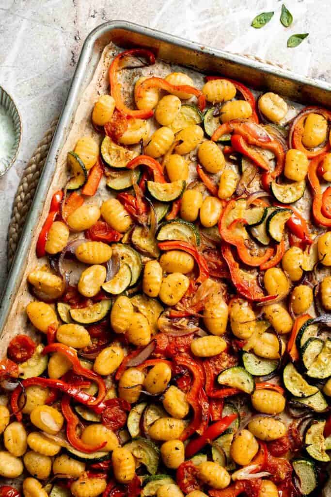 Easy sheet pan gnocchi and vegetables roasted until golden and crispy. A simple one-pan vegetarian dinner ready in 30 minutes. | aheadofthyme.com
