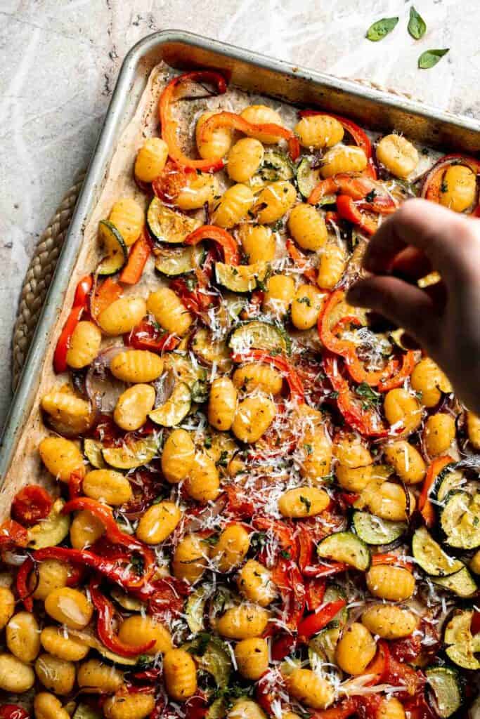 Easy sheet pan gnocchi and vegetables roasted until golden and crispy. A simple one-pan vegetarian dinner ready in 30 minutes. | aheadofthyme.com