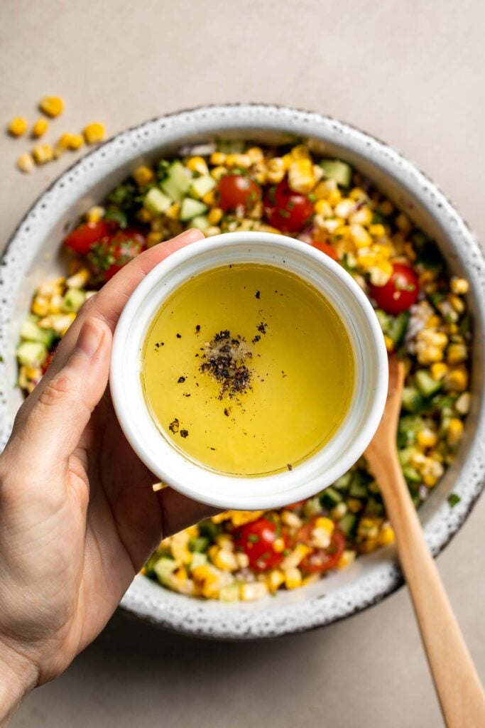 Olive oil and lime dressing ingredients for avocado corn salad.