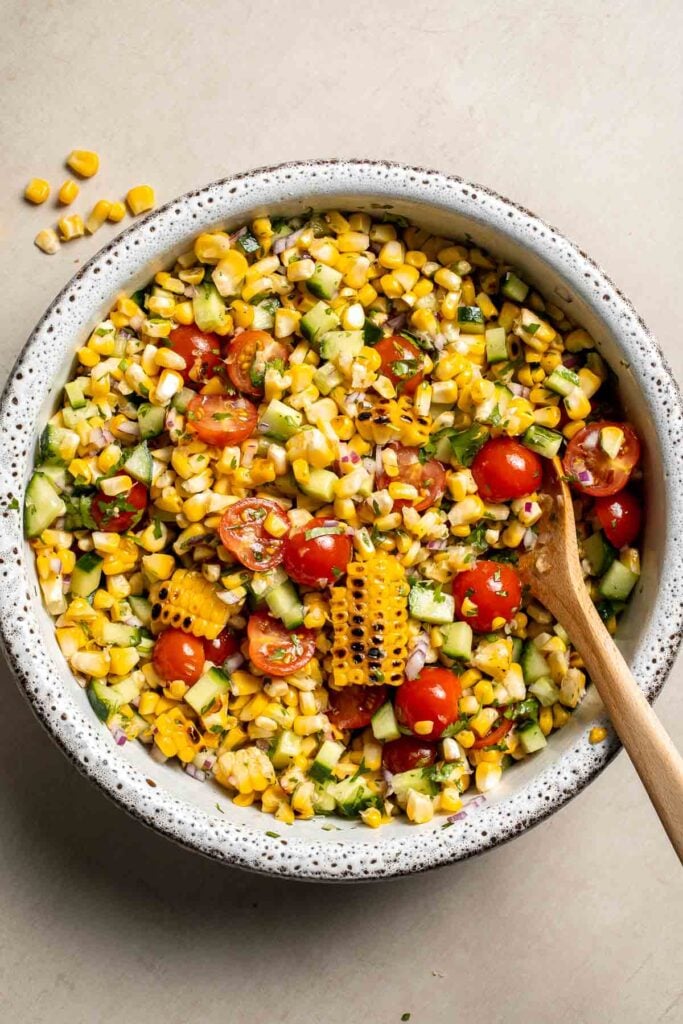 Avocado corn salad tossed with lime dressing.