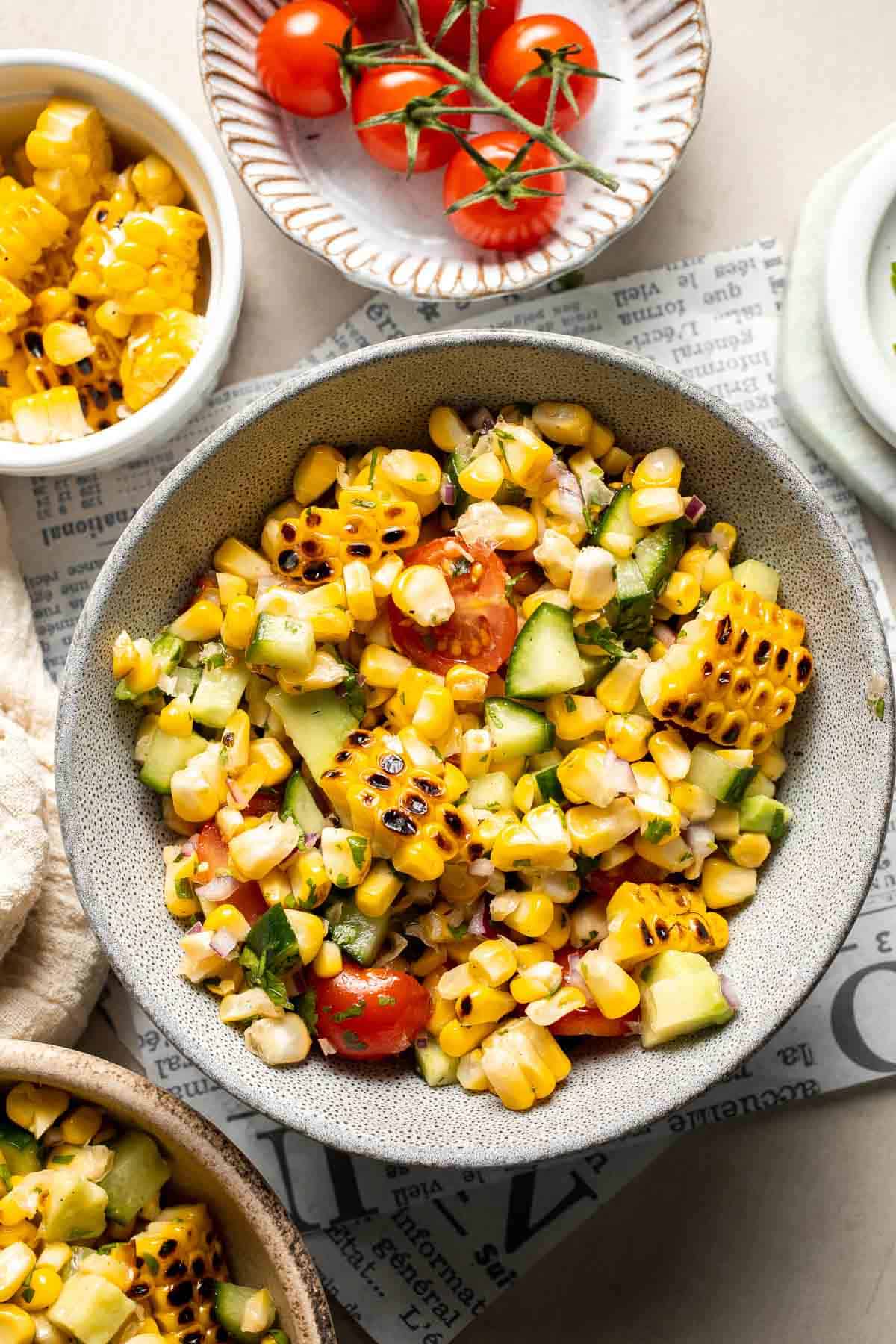 Avocado corn salad garnished and ready to serve as a summer side dish.