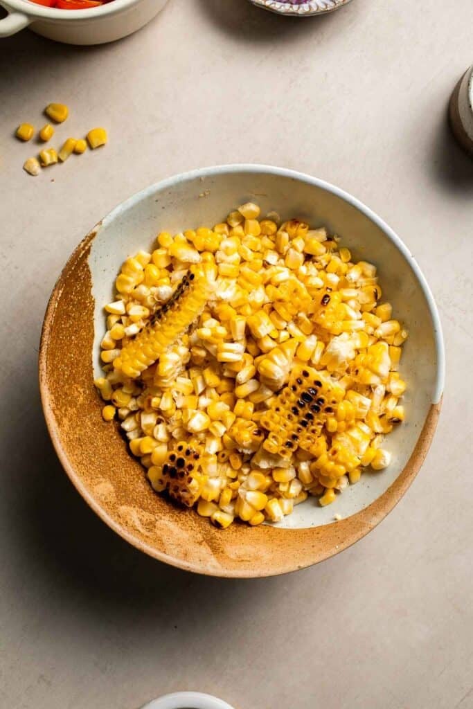 Cooked corn kernels in a bowl for avocado corn salad.