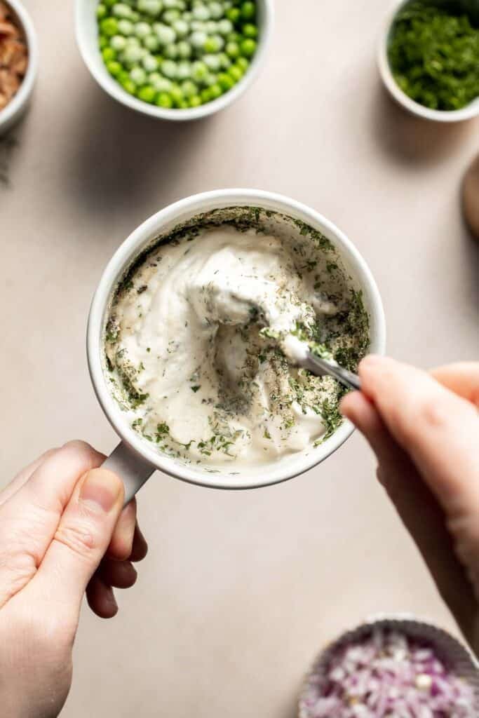 Ranch dressing being whisked together until smooth and creamy.