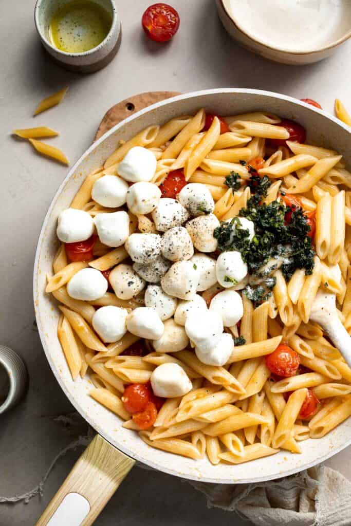 Caprese pasta tossed with fresh mozzarella, basil, and tomatoes.