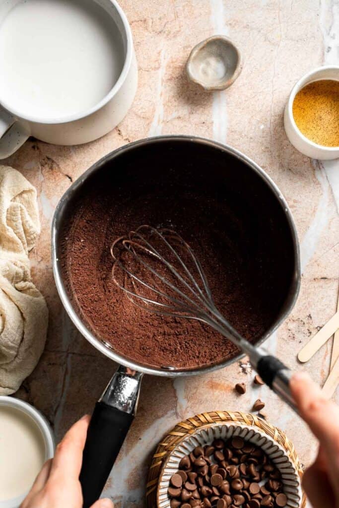 Chocolate mixture combined in a saucepan before adding milk.