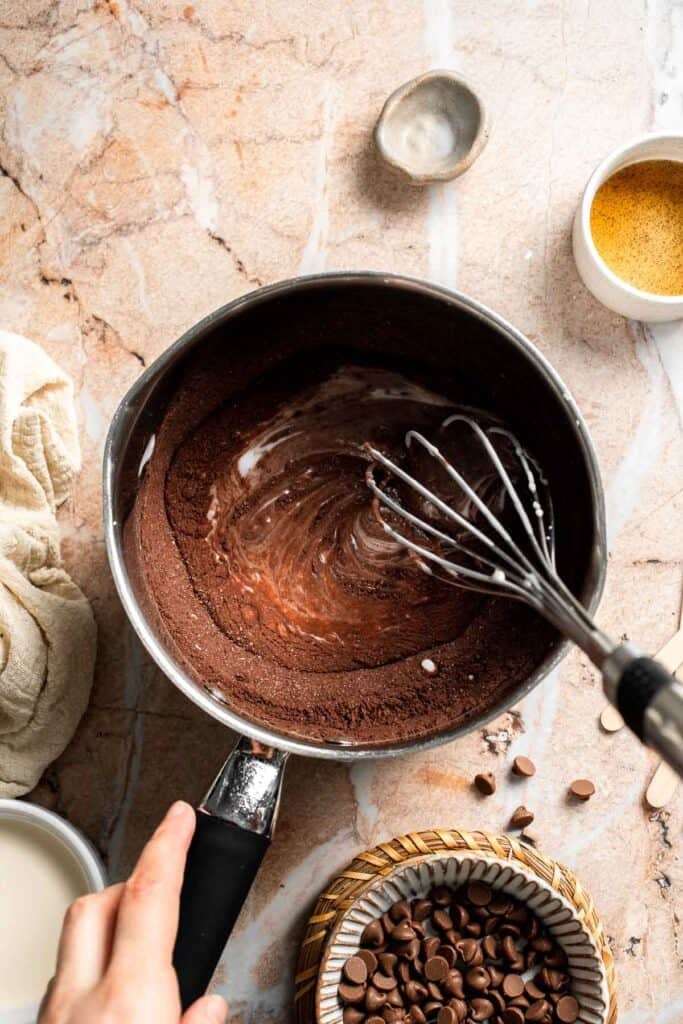 Chocolate mixture being whisked until smooth.