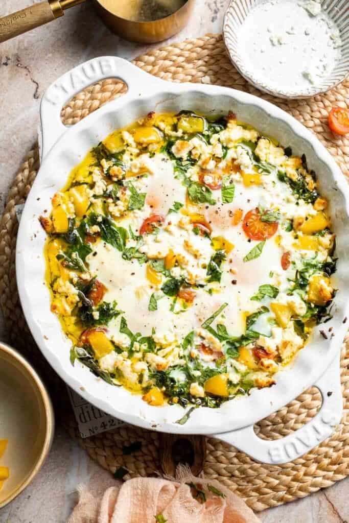 Mediterranean baked eggs baked in a casserole dish.