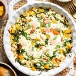 Mediterranean baked eggs with feta and tomatoes, spinach, bell peppers, and baked eggs in a one-pan breakfast dish.