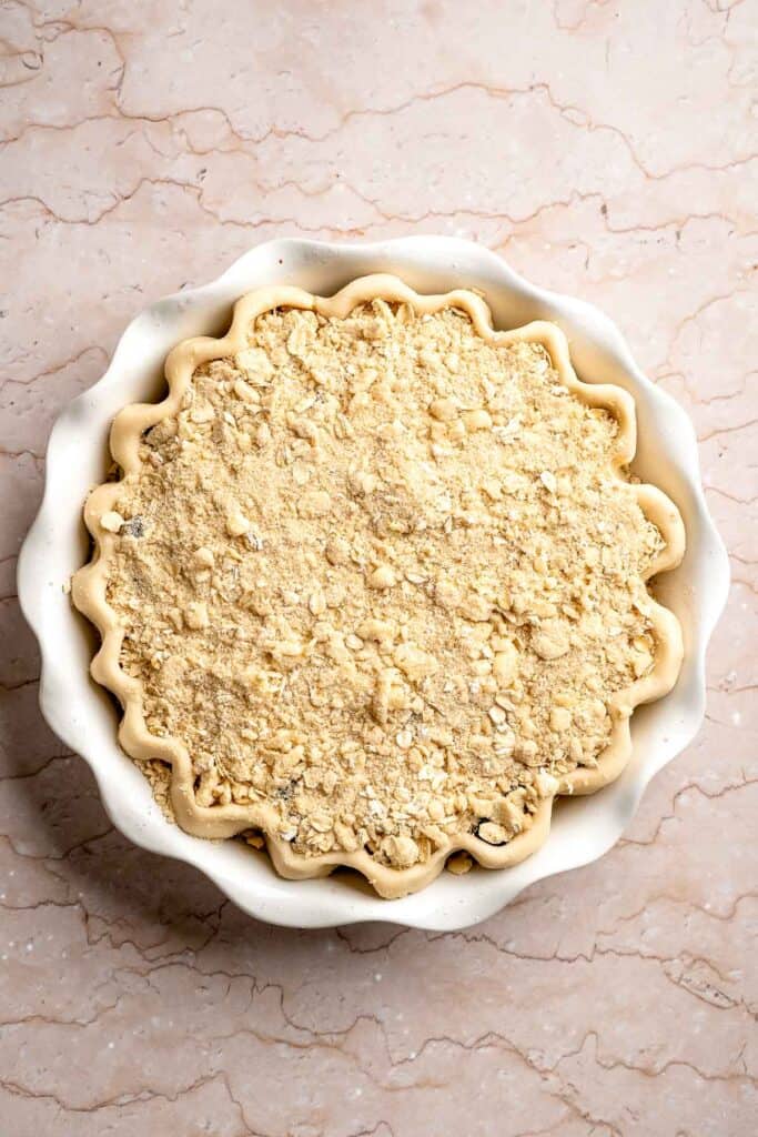 Crumble topping evenly sprinkled over the blueberry filling.