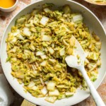 Chinese Cabbage Stir Fry served in a skillet with soy sauce and sesame oil.
