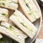 Cucumber Tea Sandwiches arranged on a serving plate with creamy herb filling, thinly sliced English cucumber, and fresh dill.