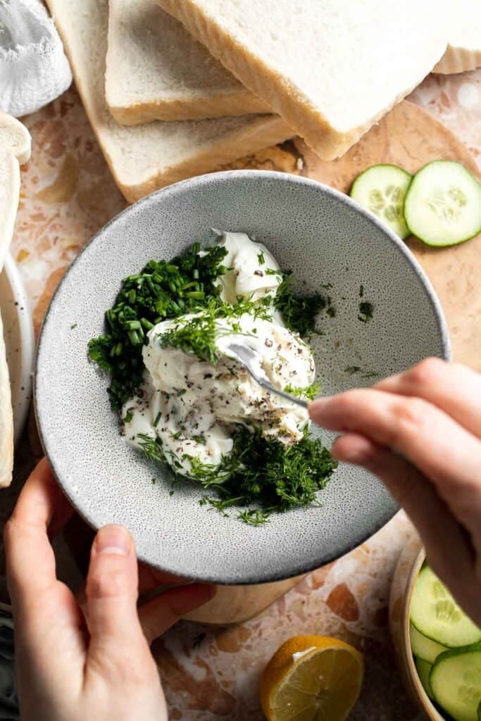 Mixing the cream cheese and fresh herb filling for Cucumber Tea Sandwiches.