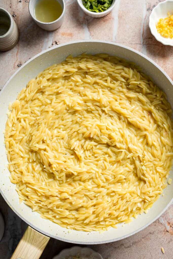 Creamy cooked orzo before adding the remaining ingredients.