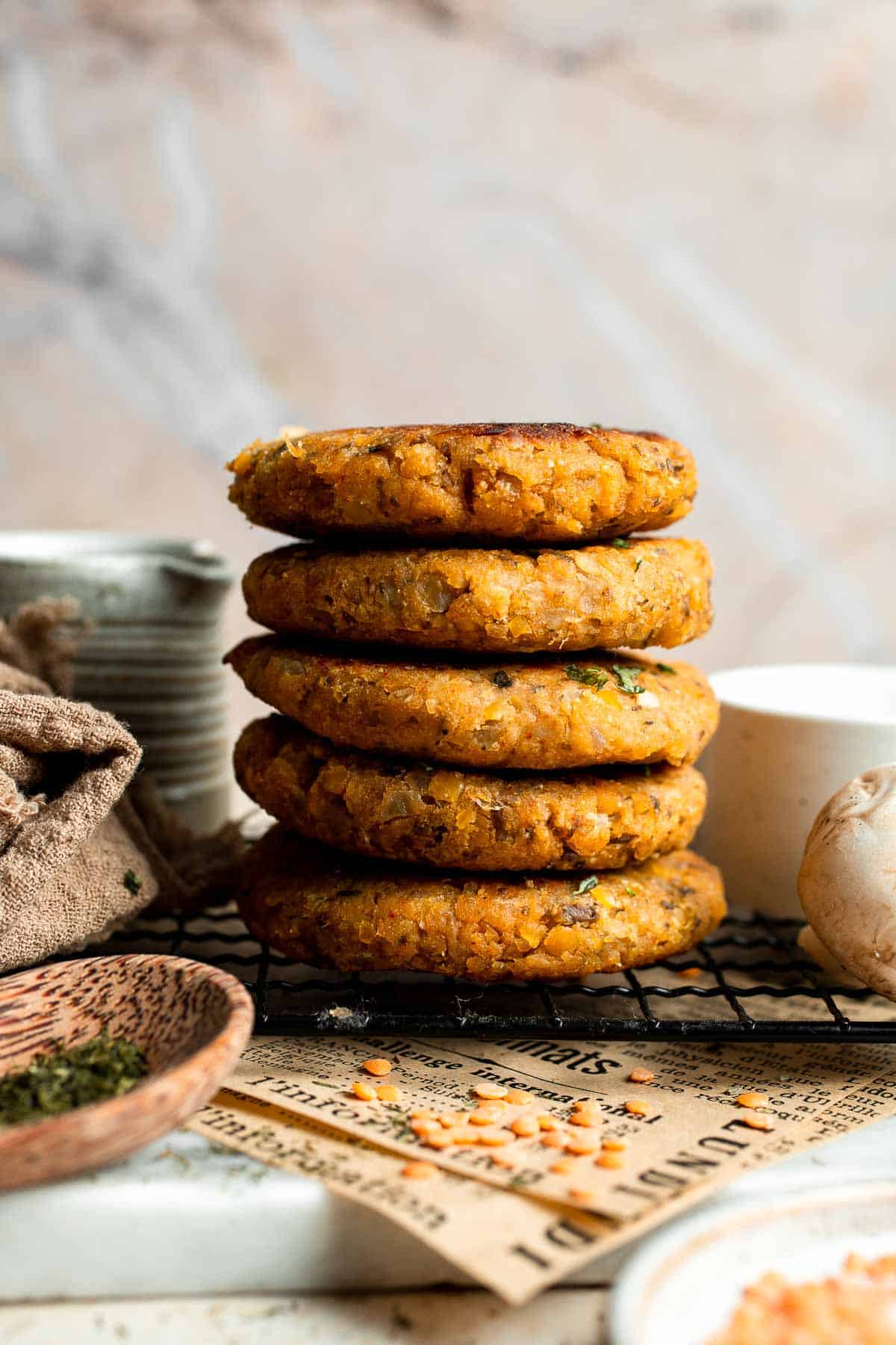 Stack of crispy red lentil patties with a golden brown exterior.