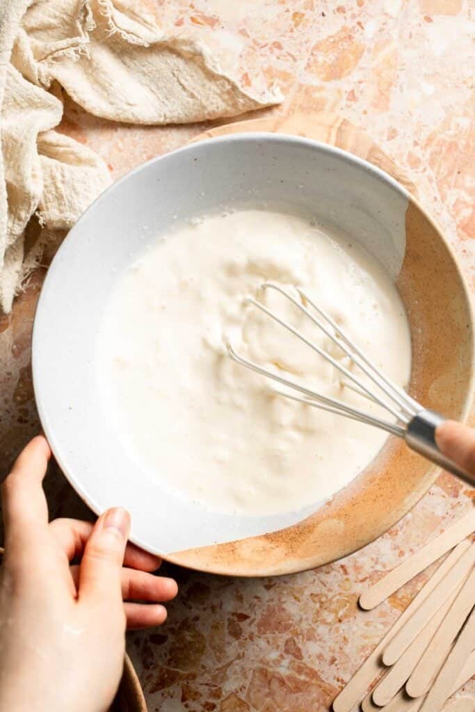 Whisking the creamy vanilla mixture for Orange Creamsicles.