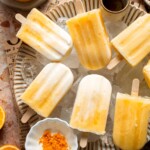 Homemade Orange Creamsicles with creamy orange and vanilla swirls.