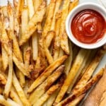 Oven Baked French Fries with crispy golden edges served with ketchup.