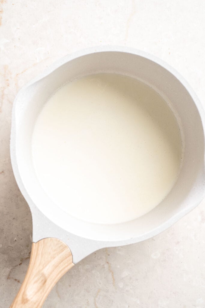 Heavy cream heated in a saucepan until steaming for the chocolate ganache filling.