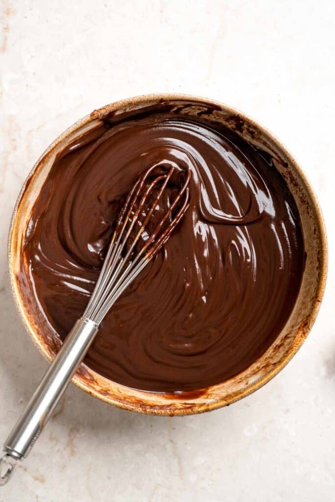 Smooth chocolate ganache filling for S'mores Pie after whisking together the chocolate and cream.