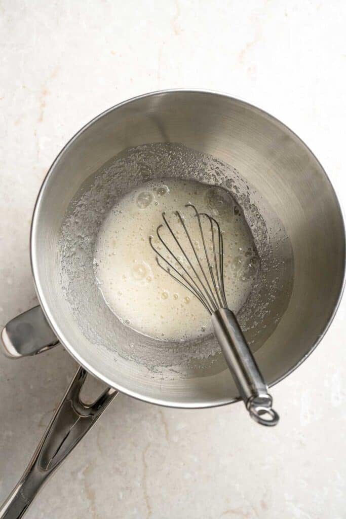 Egg whites and sugar being whisked over simmering water for the homemade marshmallow topping.