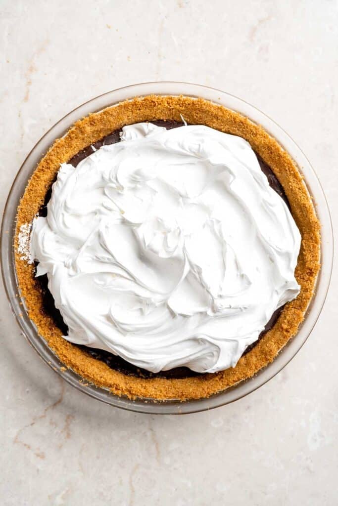 S'mores Pie topped with a thick layer of fluffy homemade marshmallow before toasting.