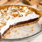 S'mores Pie with layers of buttery graham cracker crust, rich chocolate ganache, and fluffy toasted marshmallow topping.