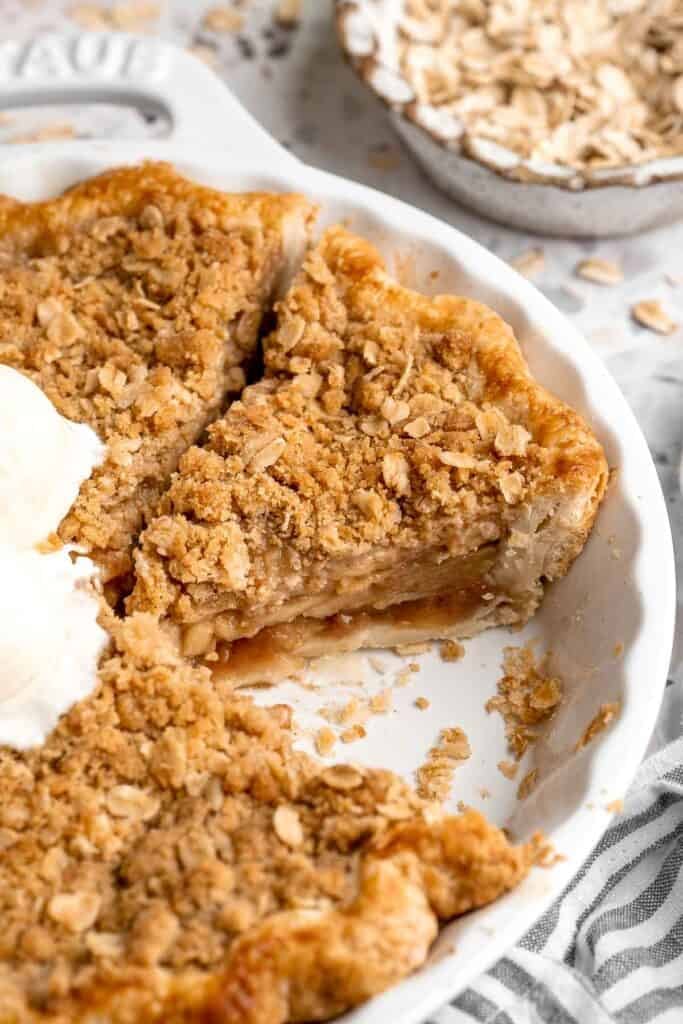 Close-up of baked apple crumble pie showing a deeply golden crumble topping