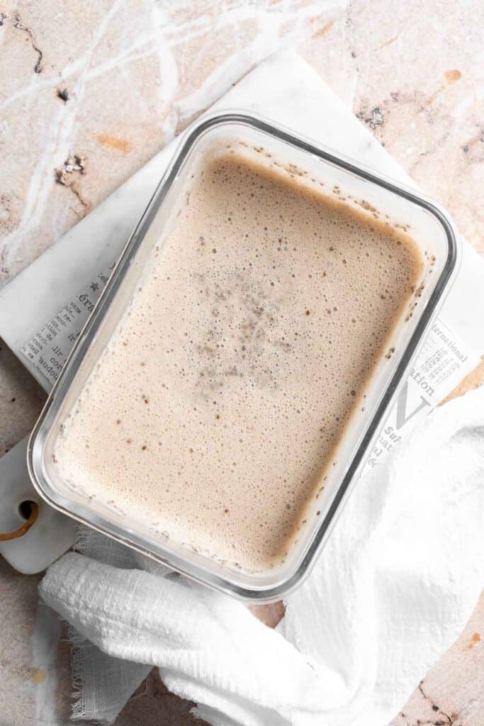 Chia pudding thickening in a glass container after chilling