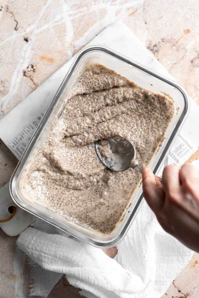Stirring banana chia pudding before serving