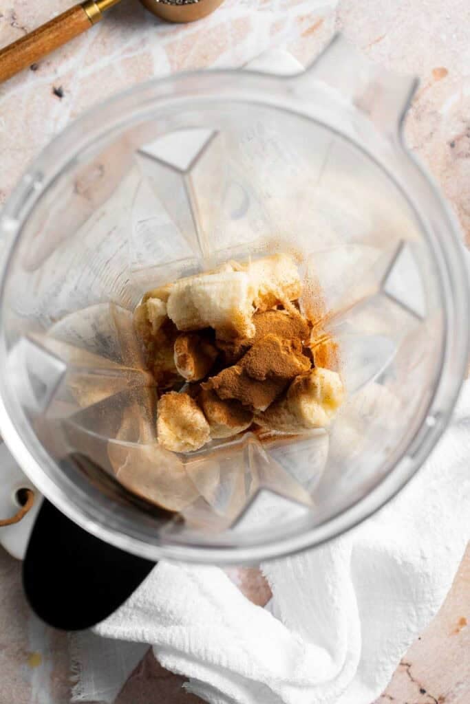 Bananas, maple syrup, vanilla extract, cinnamon, and salt in a blender before blending