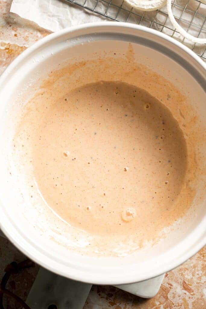 Prepared beer batter in a mixing bowl.