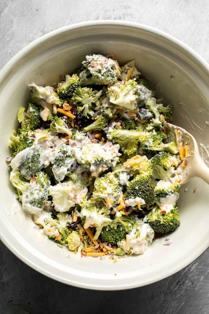 Broccoli salad tossed with creamy dressing.