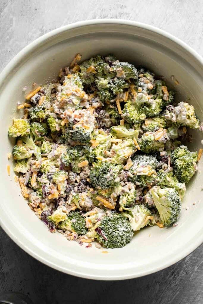 Creamy broccoli salad fully mixed and ready to chill.