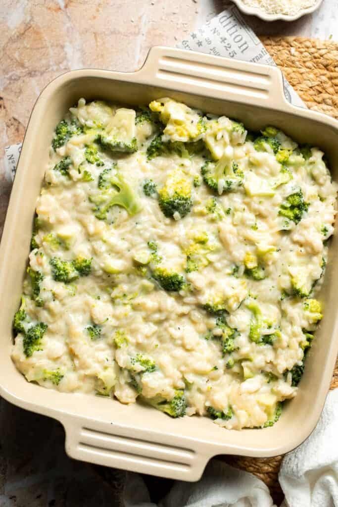 Broccoli rice casserole mixture transferred into a square baking dish