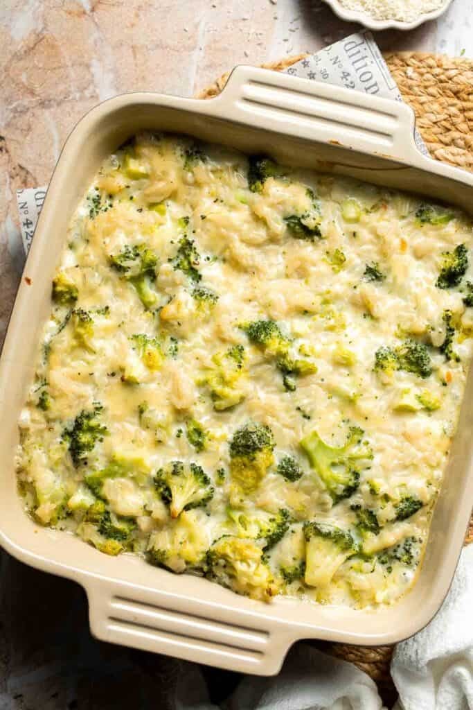 Broccoli rice casserole baked for 15 minutes before being removed to add toppings