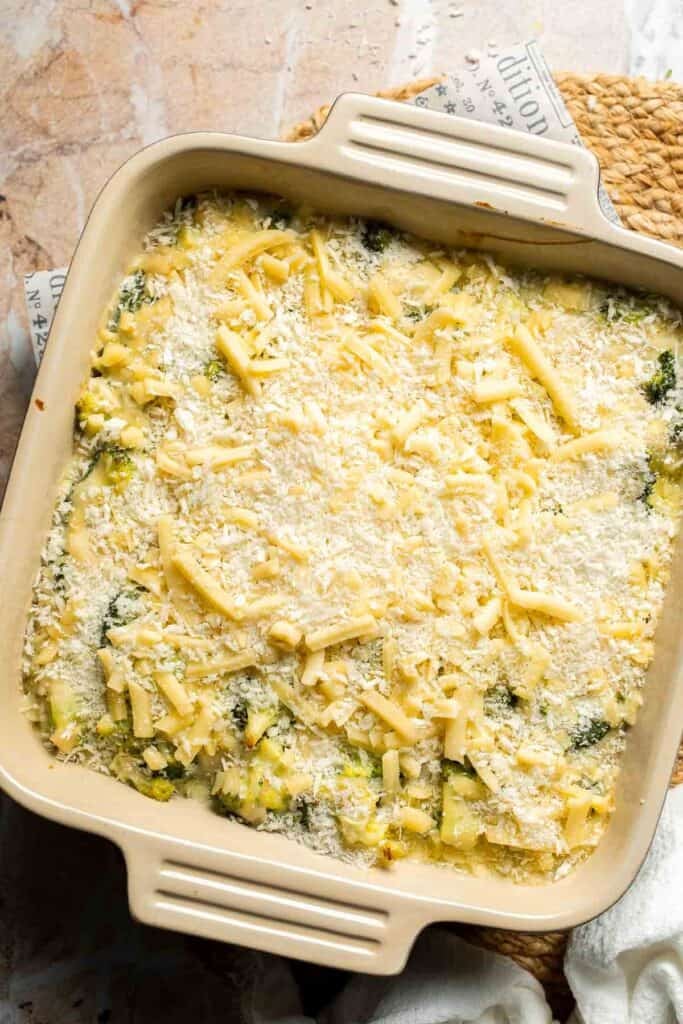 Panko breadcrumbs sprinkled over cheddar cheese on top of broccoli rice casserole
