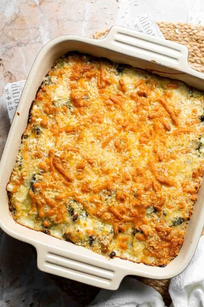 Baked cheesy broccoli rice casserole with a golden, crispy panko topping