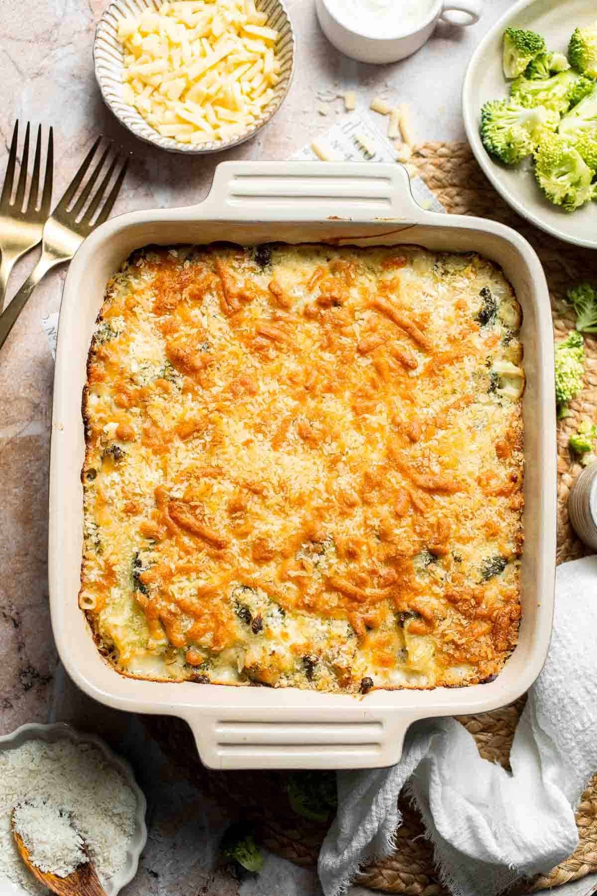 Overhead view of baked cheesy broccoli rice casserole in a square baking dish