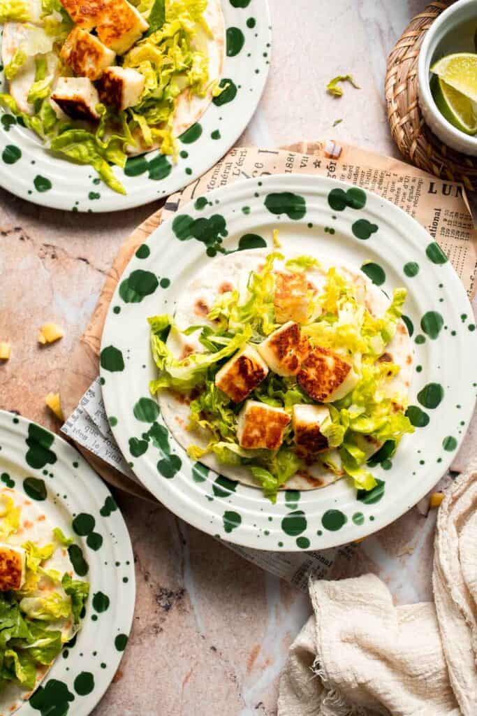 Adding crispy halloumi to the taco.
