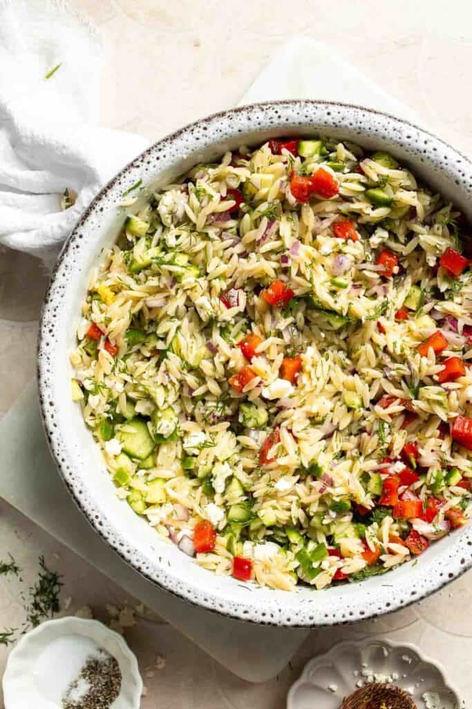 Lemon Orzo Salad with feta, cucumber, red pepper, red onion, and fresh dill.