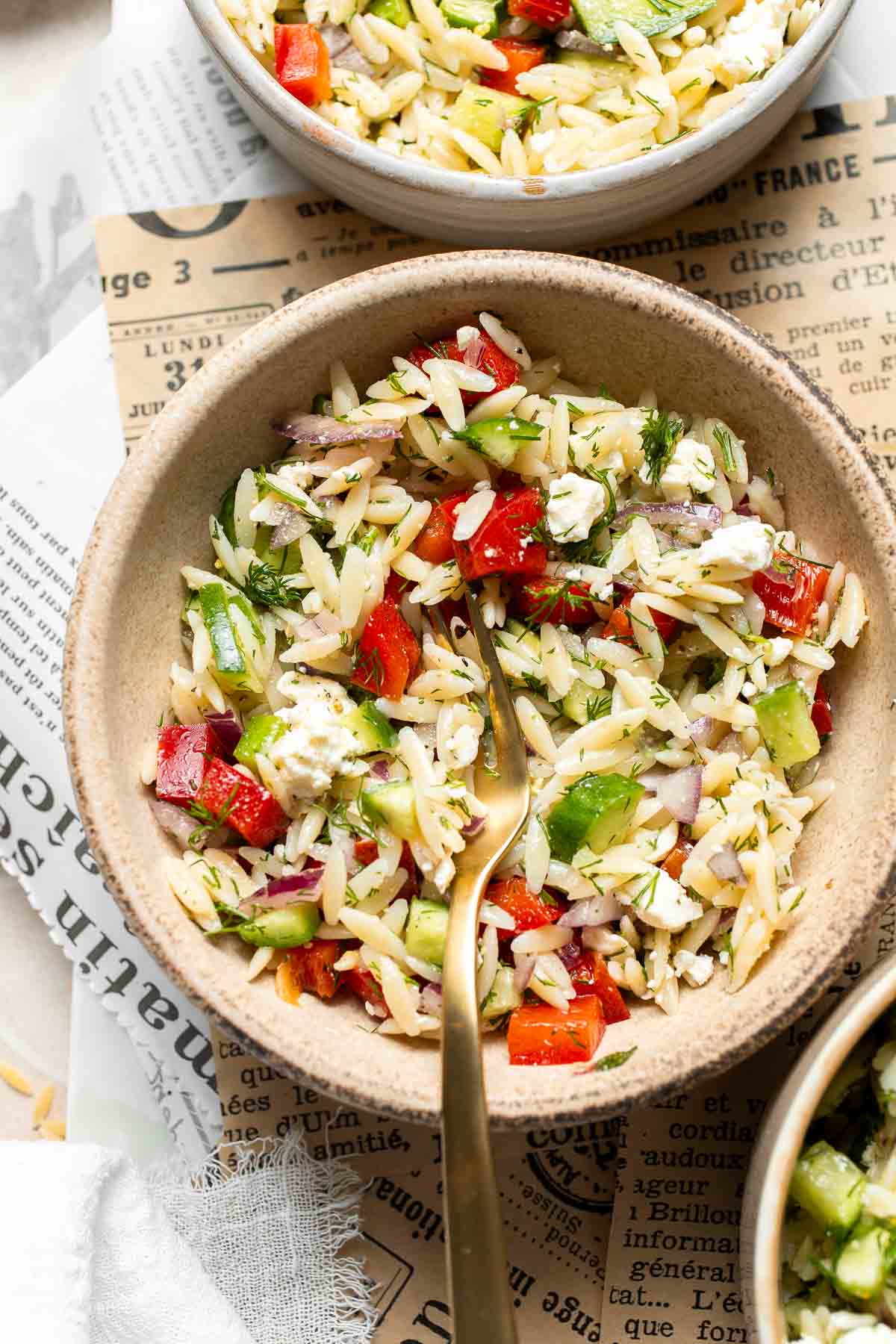 Lemon Orzo Salad with cucumber, red bell pepper, red onion, feta cheese, fresh dill, and lemon dressing.