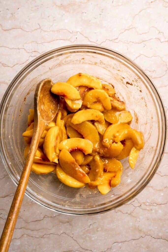 Fresh peach filling mixed with sugar, cinnamon, lemon juice, and vanilla.