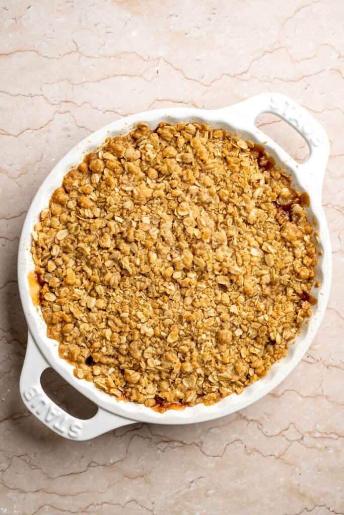 Freshly baked Peach Crisp with a golden buttery topping.