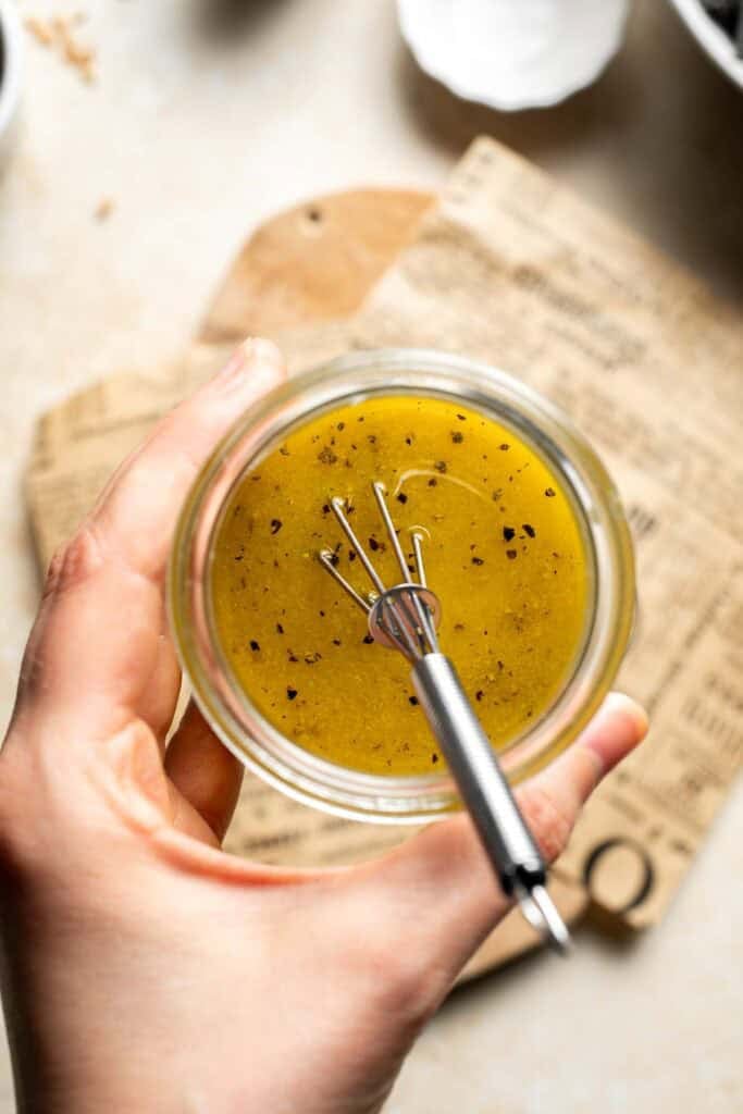 Whisked maple Dijon dressing in a small glass jar