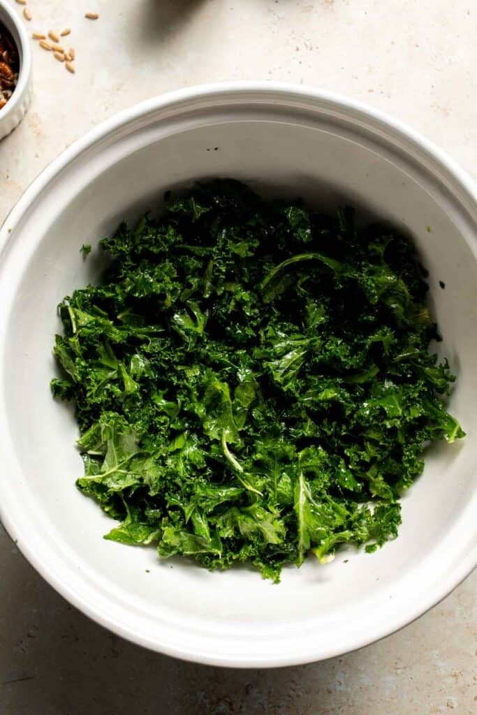 Softened, massaged kale in a large bowl