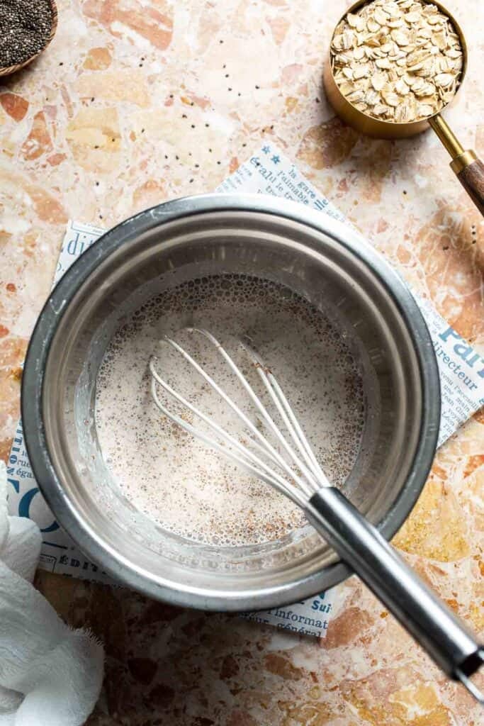 Smooth protein base being whisked in a metal bowl