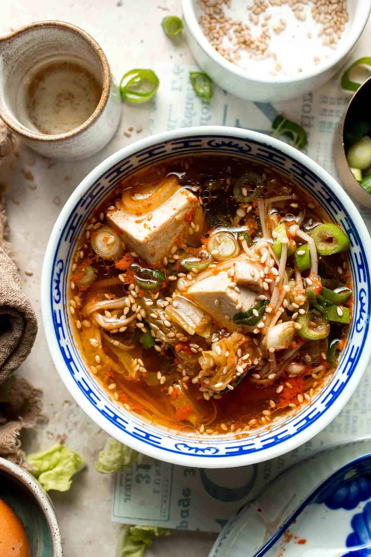 Finished Korean tofu soup with egg, tofu, and vegetables in a bowl